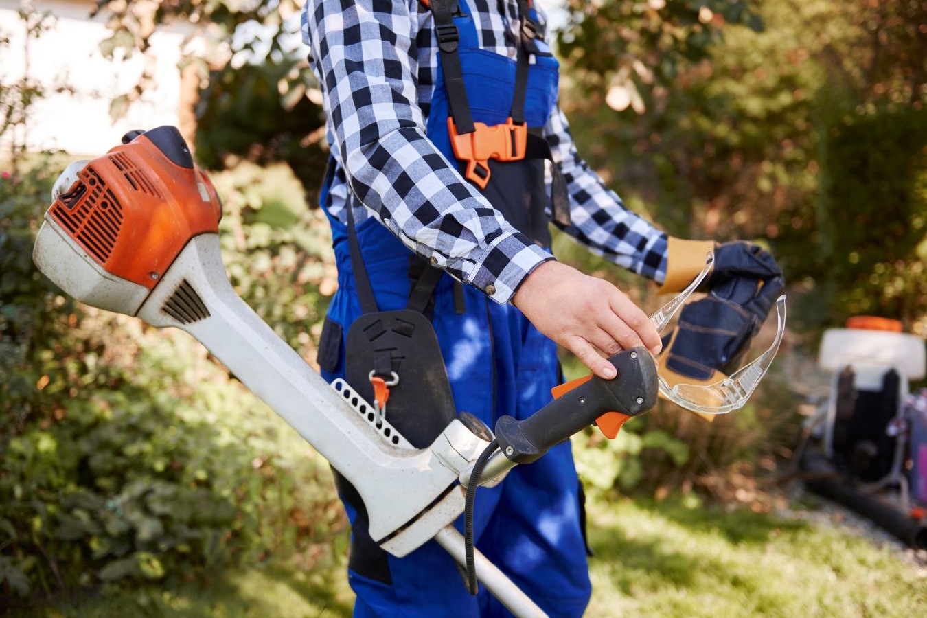 unrecognizable-gardener-with-modern-weedwacker_mini